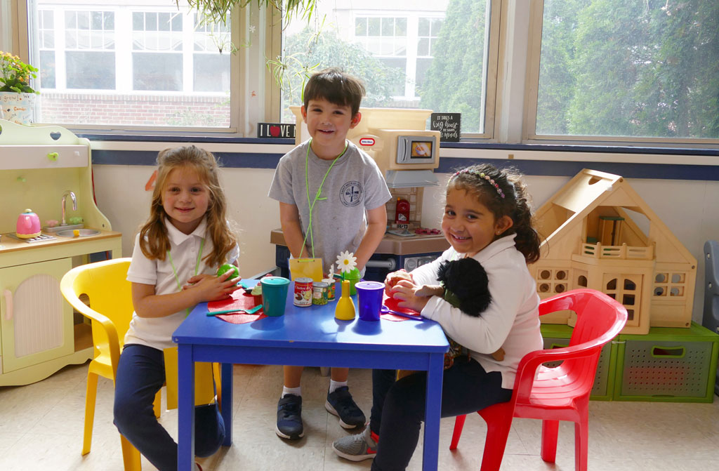 Pre-K students interacting at Saint Michael School