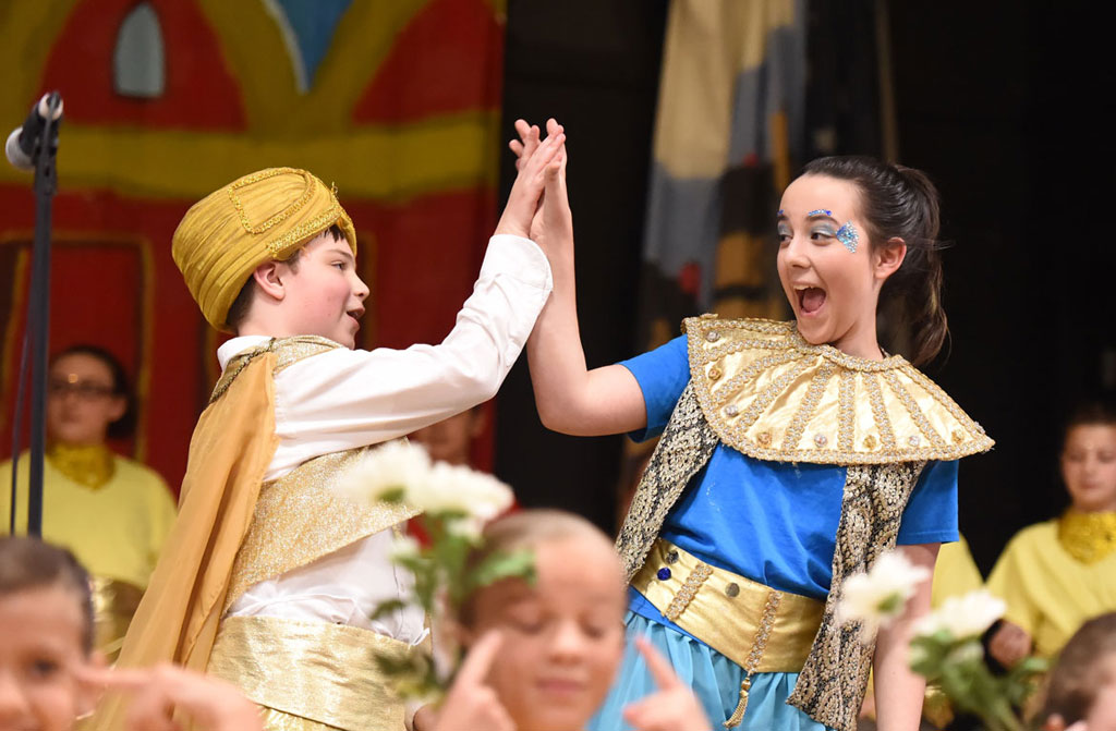 Grade 5 6 7 8 drama club students performing